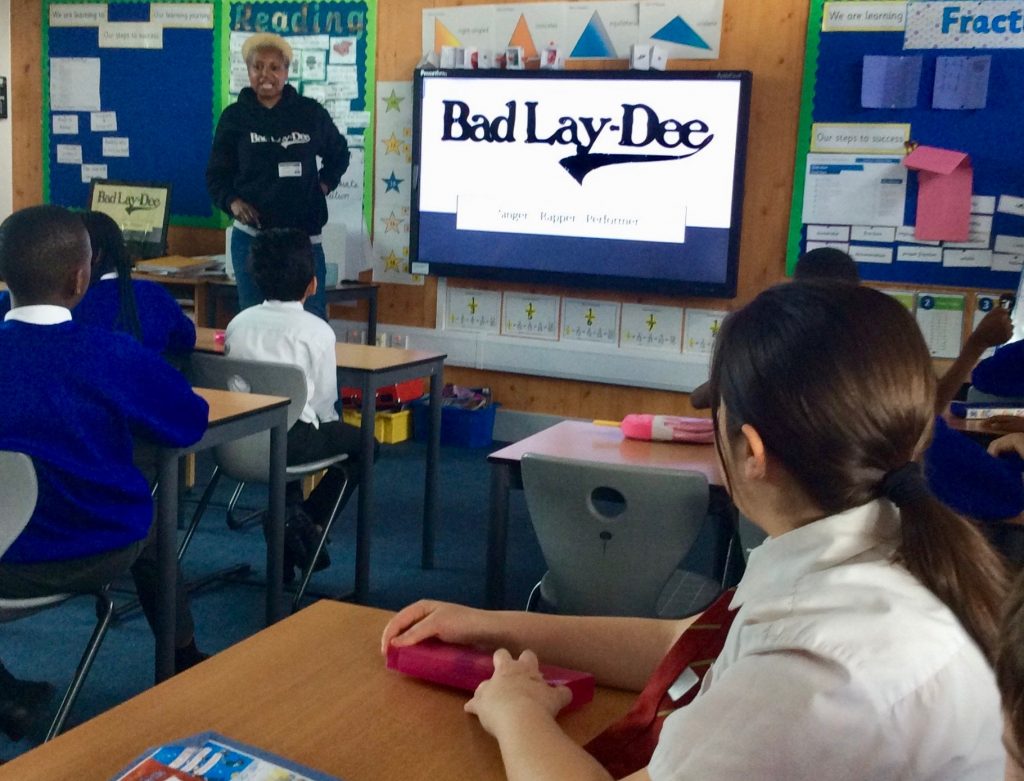 Bad Lay-Dee teaching a class of school children